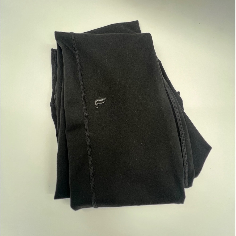 Fabletics PowerHold Black High Waisted Flare Leggings with Side Slits Women